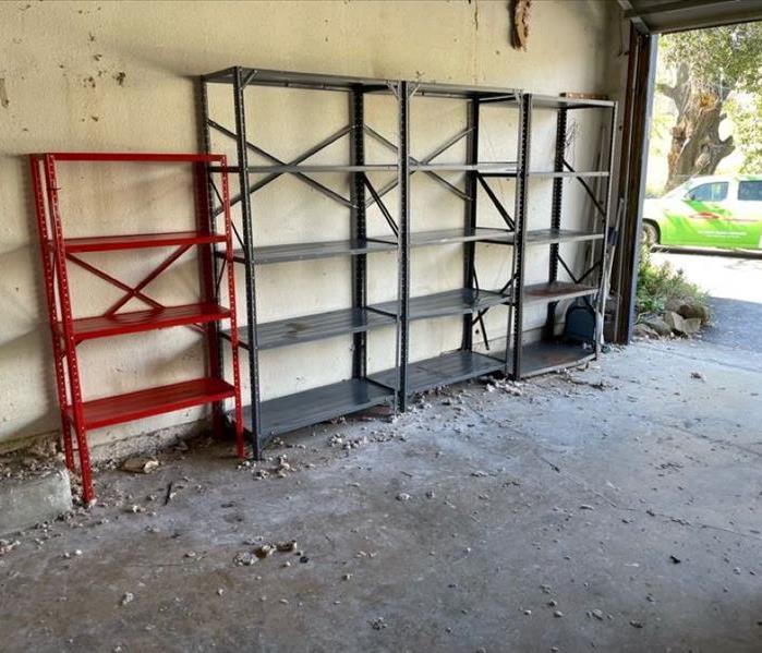 Image shows metal shelves empty