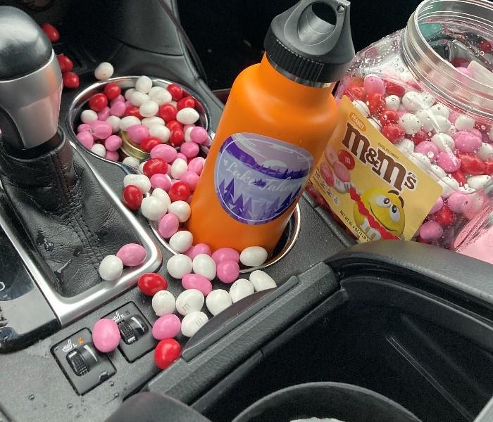 Image shows colored M&M's spilled inside a vehicle